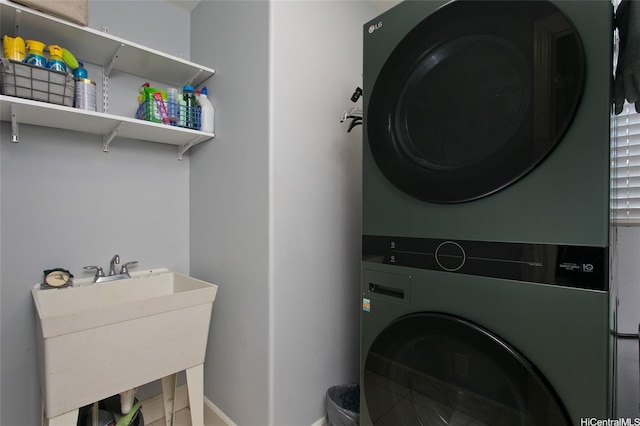 91-1526 Kaikohola St Unit D1, Ewa Beach, HI 96706 - laundry room with stacked washer / dryer and baseboards