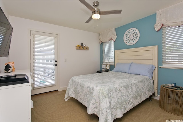 91-1526 Kaikohola St Unit D1, Ewa Beach, HI 96706 - bedroom featuring access to exterior, light colored carpet, and ceiling fan