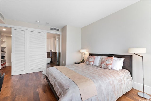 1108 Auahi St Unit 2906, Honolulu, HI 96814 - bedroom with wood finished floors, ensuite bath, and recessed lighting