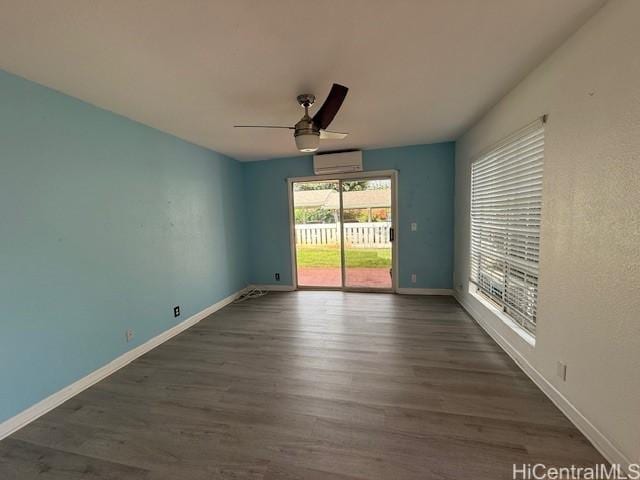 94-586 Lumiauau St Unit N104, Waipahu, HI 96797 - empty room featuring a ceiling fan, an AC wall unit, and wood finished floors