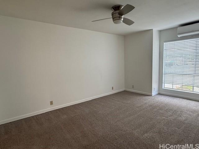 94-586 Lumiauau St Unit N104, Waipahu, HI 96797 - carpeted empty room featuring a wall mounted AC and a ceiling fan