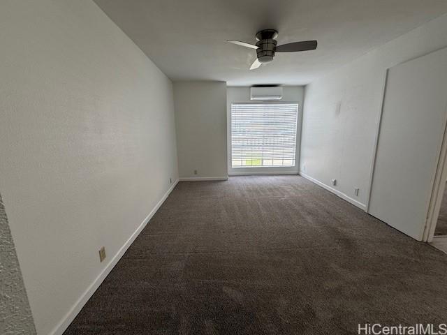 94-586 Lumiauau St Unit N104, Waipahu, HI 96797 - empty room with a wall mounted AC, carpet flooring, and ceiling fan