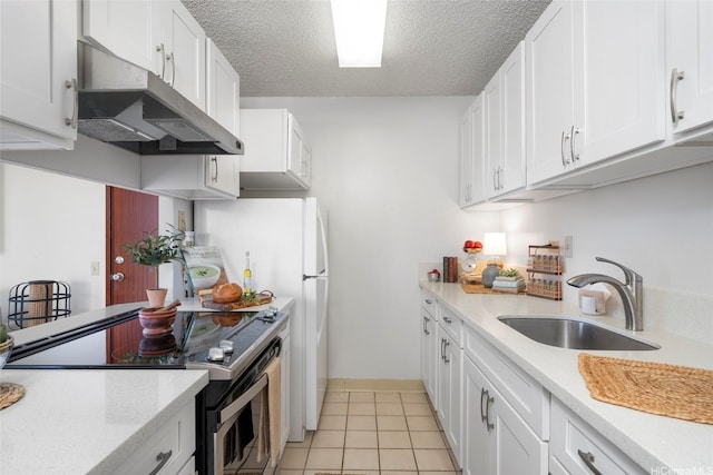 2740 Kuilei St Unit 803, Honolulu, HI 96826 - kitchen featuring electric stove, under cabinet range hood, light countertops, white cabinets, and a textured ceiling