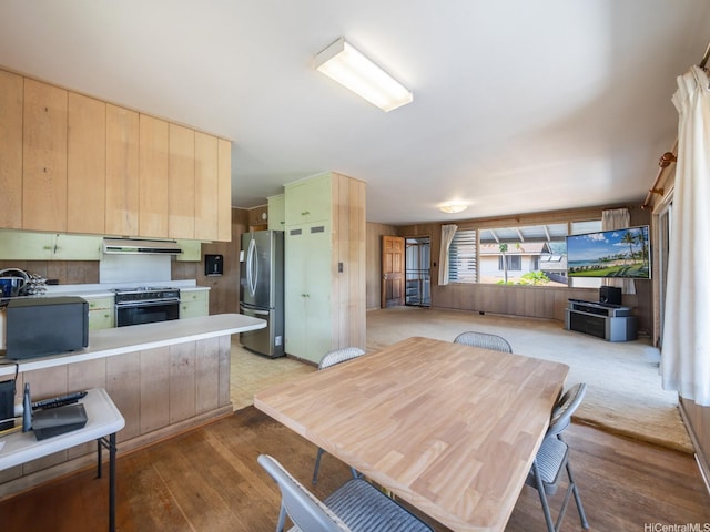 1114 8th Ave, Honolulu, HI 96816 - kitchen with range hood, freestanding refrigerator, range with electric cooktop, light wood-style flooring, and light countertops