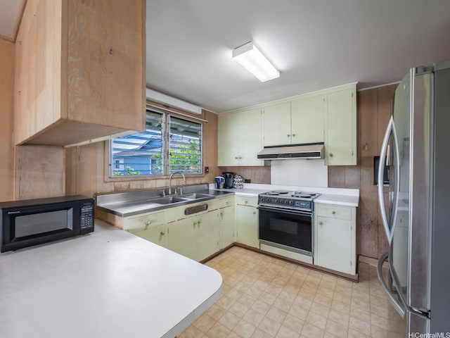 1114 8th Ave, Honolulu, HI 96816 - kitchen with freestanding refrigerator, range with electric cooktop, black microwave, under cabinet range hood, and light flooring