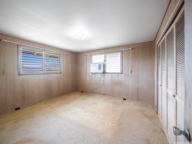 1114 8th Ave, Honolulu, HI 96816 - unfurnished bedroom featuring a closet, cooling unit, wood walls, and carpet floors