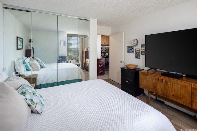 2115 Ala Wai Blvd Unit 1003, Honolulu, HI 96815 - bedroom featuring a closet and wood finished floors