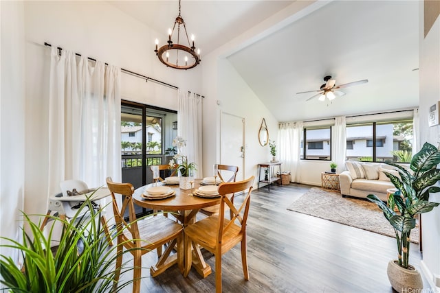 95-150 Kuahelani Ave Unit 255, Mililani, HI 96789 - dining room with a chandelier, wood finished floors, a ceiling fan, and high vaulted ceiling