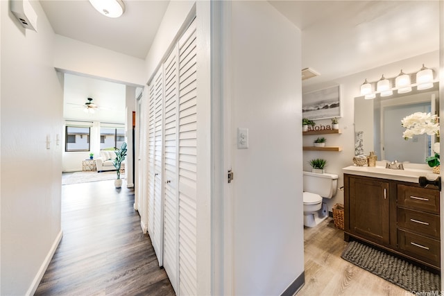 95-150 Kuahelani Ave Unit 255, Mililani, HI 96789 - corridor with wood finished floors and a sink