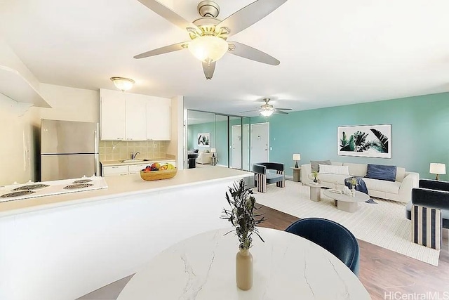 84-754 Ala Mahiku St Unit 1248B, Waianae, HI 96792 - dining area featuring wood finished floors and ceiling fan