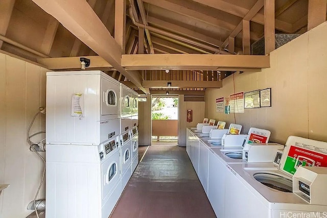 84-754 Ala Mahiku St Unit 1248B, Waianae, HI 96792 - shared laundry room featuring stacked washer and clothes dryer, washing machine and clothes dryer, and dark wood-type flooring