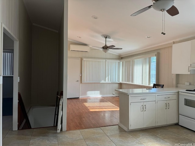 99-146 Kulina St, Aiea, HI 96701 - kitchen featuring ceiling fan, a wall mounted AC, white electric stove, lofted ceiling, and a peninsula