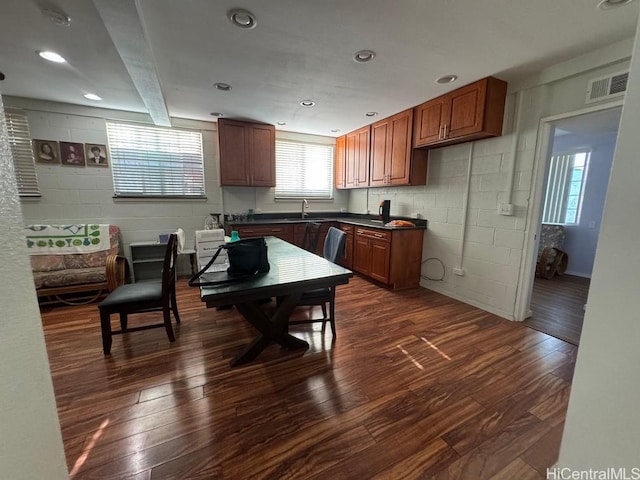 99-146 Kulina St, Aiea, HI 96701 - kitchen with dark countertops, healthy amount of natural light, and concrete block wall