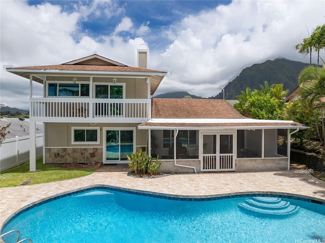 46-259 Kalali St, Kaneohe, HI 96744 - back of house featuring a balcony, a patio area, a mountain view, and roof with shingles