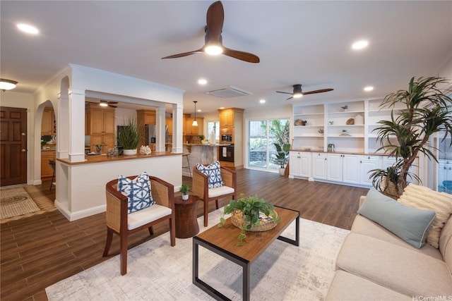 46-259 Kalali St, Kaneohe, HI 96744 - living area featuring wood finished floors, ceiling fan, arched walkways, and recessed lighting