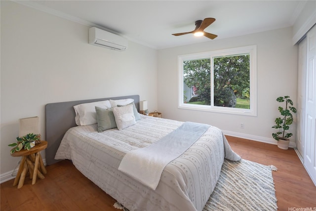 46-259 Kalali St, Kaneohe, HI 96744 - bedroom featuring a wall unit AC, wood finished floors, crown molding, and ceiling fan