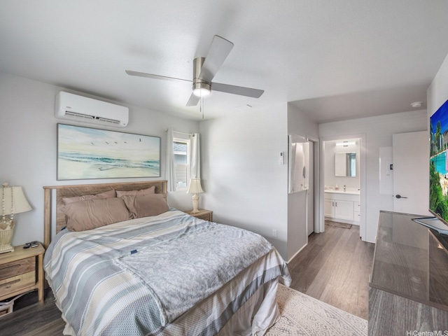 91-1348 Kakiwi St, Ewa Beach, HI 96706 - bedroom featuring an AC wall unit, wood finished floors, ensuite bath, and a ceiling fan
