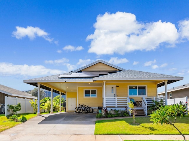 91-1348 Kakiwi St, Ewa Beach, HI 96706 - view of front of house with driveway, covered porch, a shingled roof, solar panels, and an attached carport