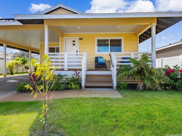91-1348 Kakiwi St, Ewa Beach, HI 96706 - view of front of house featuring a front yard, a porch, and a carport