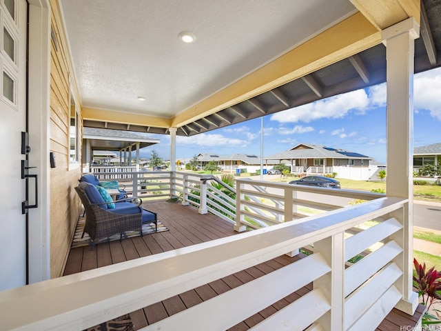 91-1348 Kakiwi St, Ewa Beach, HI 96706 - wooden porch featuring a residential view