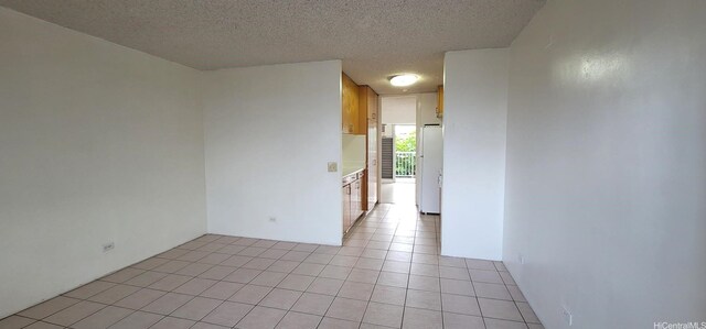 1516 Ward Ave Unit 207, Honolulu, HI 96822 - empty room with a textured ceiling and light tile patterned floors
