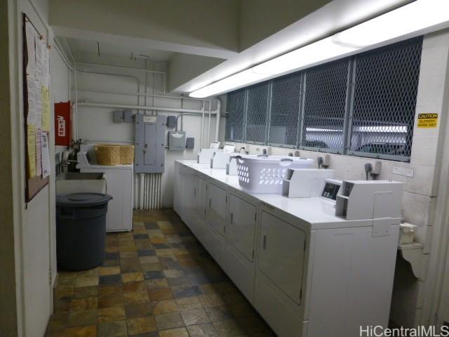 1516 Ward Ave Unit 207, Honolulu, HI 96822 - community laundry room with washing machine and dryer, electric panel, and stone finish floors