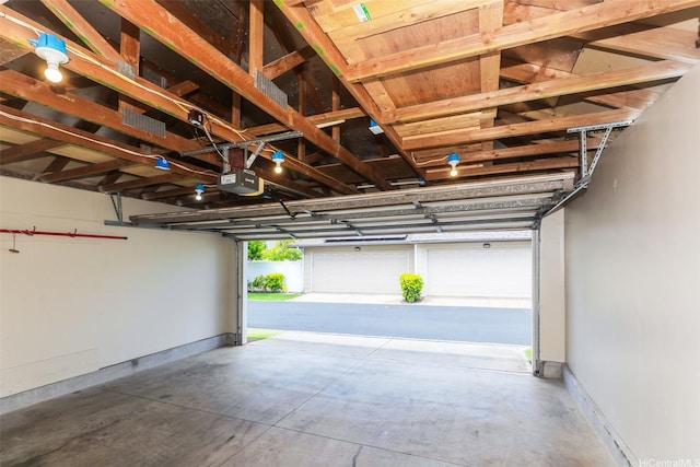 91-1073 Kaianae St, Ewa Beach, HI 96706 - garage with a garage door opener and baseboards