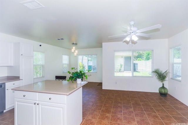 91-1073 Kaianae St, Ewa Beach, HI 96706 - kitchen featuring white cabinetry, a center island, ceiling fan, and light countertops