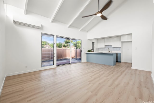 94-431 Keaoopua St Unit 104, Mililani, HI 96789 - unfurnished living room with high vaulted ceiling, a ceiling fan, beamed ceiling, light wood-type flooring, and an AC wall unit