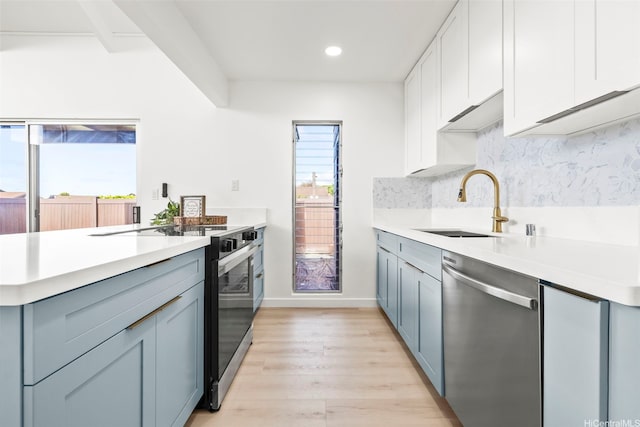 94-431 Keaoopua St Unit 104, Mililani, HI 96789 - kitchen with dishwasher, a peninsula, light wood finished floors, light countertops, and recessed lighting