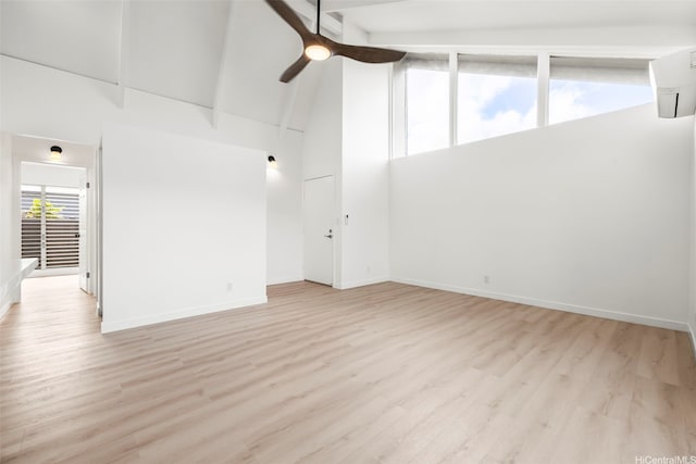 94-431 Keaoopua St Unit 104, Mililani, HI 96789 - unfurnished room with high vaulted ceiling, a ceiling fan, an AC wall unit, wood finished floors, and beam ceiling