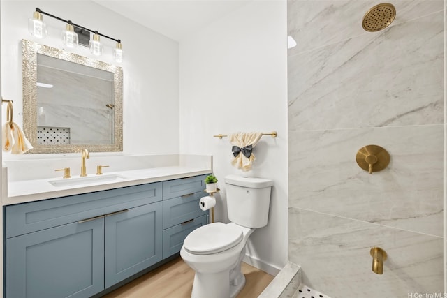 94-431 Keaoopua St Unit 104, Mililani, HI 96789 - bathroom featuring a tile shower, wood finished floors, and vanity