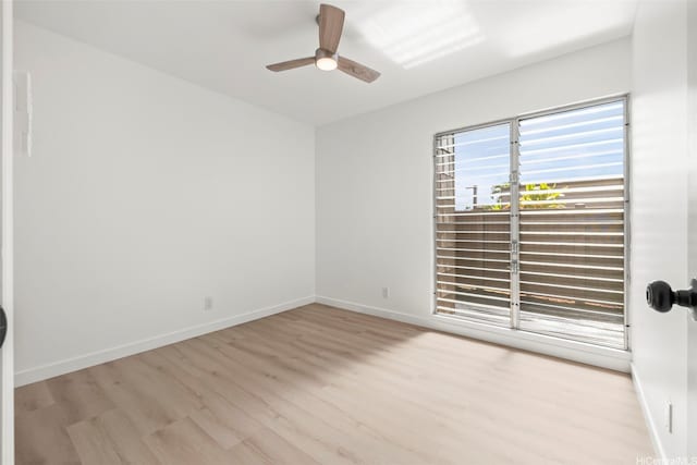 94-431 Keaoopua St Unit 104, Mililani, HI 96789 - empty room featuring light wood finished floors and ceiling fan