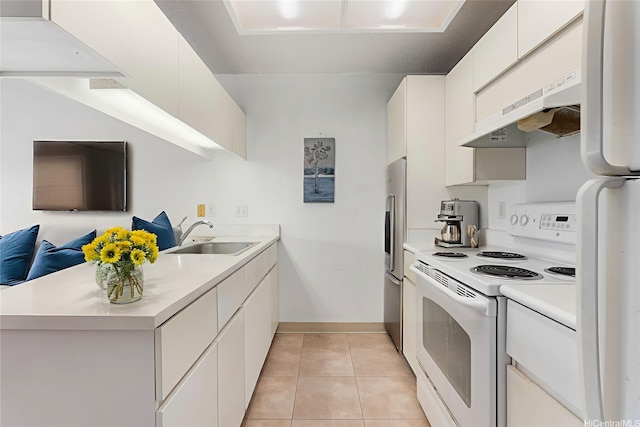 94-1079 Kepakepa St Unit H8, Waipahu, HI 96797 - kitchen featuring white appliances, ventilation hood, light countertops, and a peninsula