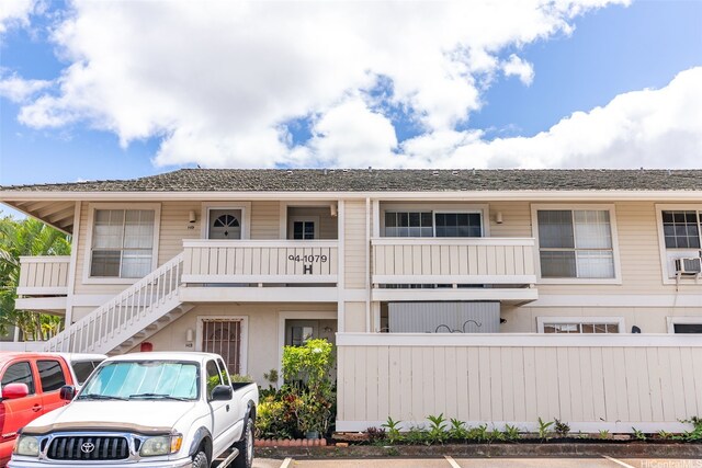 94-1079 Kepakepa St Unit H8, Waipahu, HI 96797 - view of front of property featuring uncovered parking, stairway, and cooling unit