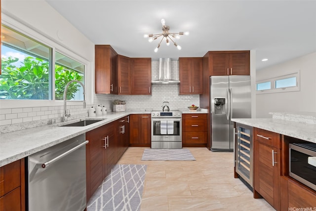 1034 Kaumoku St, Honolulu, HI 96825 - kitchen featuring stainless steel appliances, wall chimney exhaust hood, wine cooler, a chandelier, and backsplash