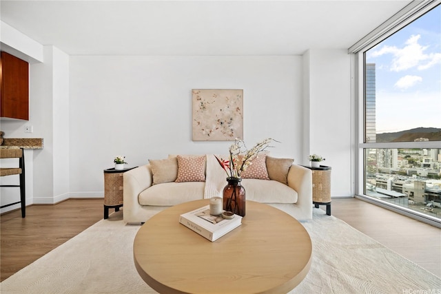 909 Kapiolani Blvd Unit 2305, Honolulu, HI 96814 - living area featuring floor to ceiling windows and wood finished floors