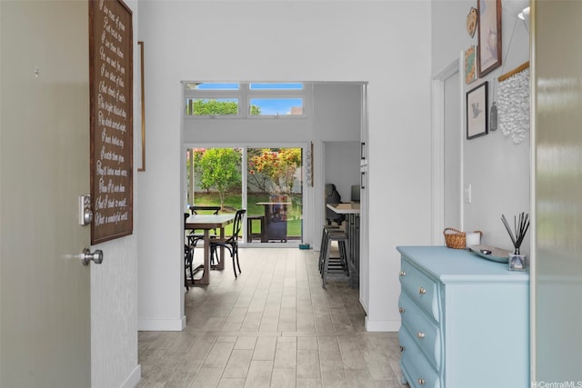 7780 Waikapu Loop, Honolulu, HI 96825 - hallway featuring a towering ceiling and light wood finished floors