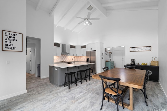 7780 Waikapu Loop, Honolulu, HI 96825 - dining space with high vaulted ceiling, ceiling fan, beamed ceiling, and light wood-style floors