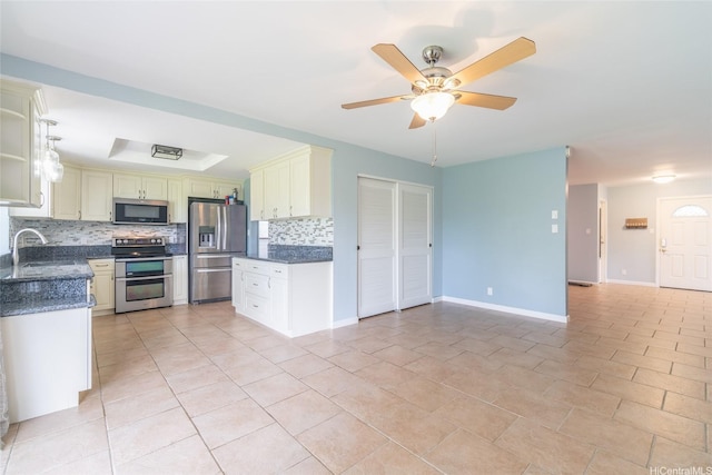 1335 Onioni St, Kailua, HI 96734 - kitchen with appliances with stainless steel finishes, decorative backsplash, open floor plan, ceiling fan, and light tile patterned flooring