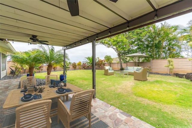 1335 Onioni St, Kailua, HI 96734 - fenced backyard with an outdoor living space, a patio area, ceiling fan, and outdoor dining area