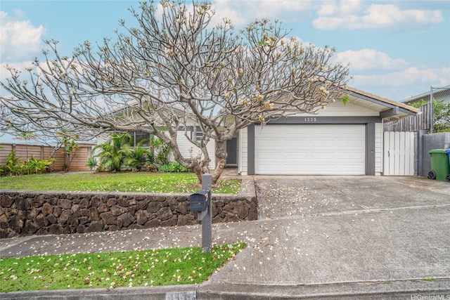 1335 Onioni St, Kailua, HI 96734 - view of front of property featuring concrete driveway and an attached garage