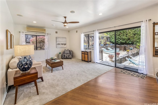 5926 Kalanianaole Hwy, Honolulu, HI 96821 - living area with an AC wall unit, healthy amount of natural light, wood finished floors, recessed lighting, and a ceiling fan