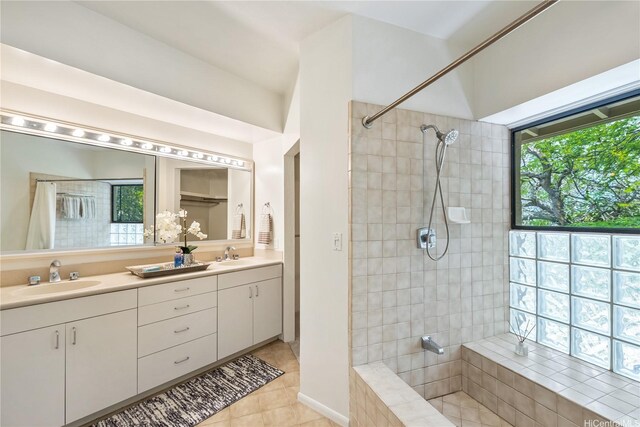 5926 Kalanianaole Hwy, Honolulu, HI 96821 - bathroom featuring tiled shower, double vanity, and tile patterned floors