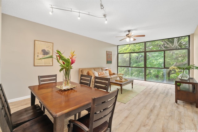 1020 Aoloa Pl Unit 311B, Kailua, HI 96734 - dining space with floor to ceiling windows, a ceiling fan, and light wood finished floors