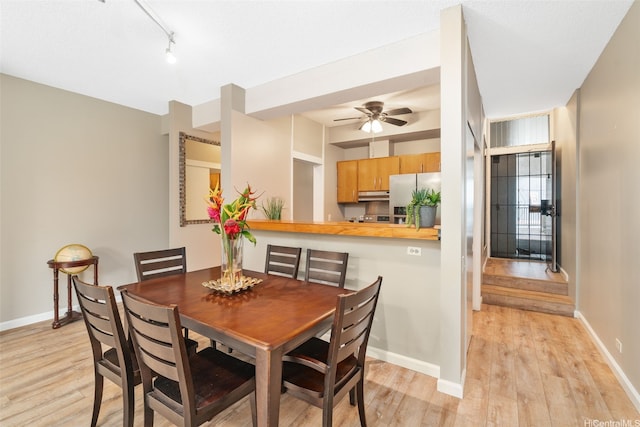 1020 Aoloa Pl Unit 311B, Kailua, HI 96734 - dining room featuring light wood finished floors, a ceiling fan, and rail lighting