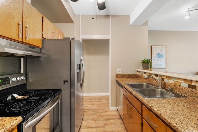 1020 Aoloa Pl Unit 311B, Kailua, HI 96734 - kitchen with stainless steel appliances, under cabinet range hood, ceiling fan, light wood-type flooring, and a textured ceiling