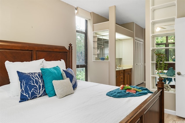 1020 Aoloa Pl Unit 311B, Kailua, HI 96734 - bedroom with multiple windows and ensuite bathroom