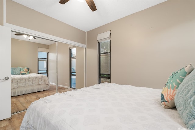 1020 Aoloa Pl Unit 311B, Kailua, HI 96734 - bedroom featuring wood finished floors, a closet, and a ceiling fan