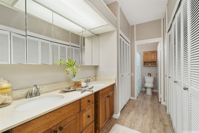 1020 Aoloa Pl Unit 311B, Kailua, HI 96734 - bathroom with a closet, wood-type flooring, and double vanity